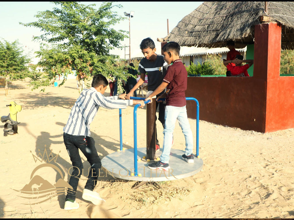 a group of children playing on a playground
